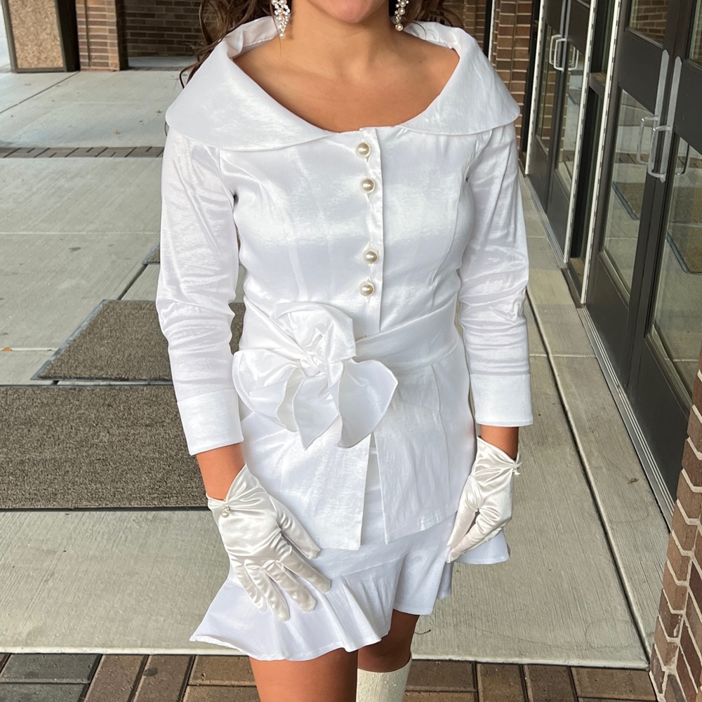 HerringStone's white suit with skirt and jacket